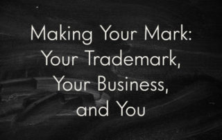 A recently-erased chalkboard, still smeared with dust, overlaid with the title of the blog post: "Making Your Mark: Your Trademark, Your Business, and You"